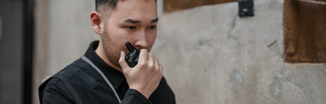 man-holding-walkie-talkie