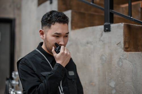 a security officer using a communication device