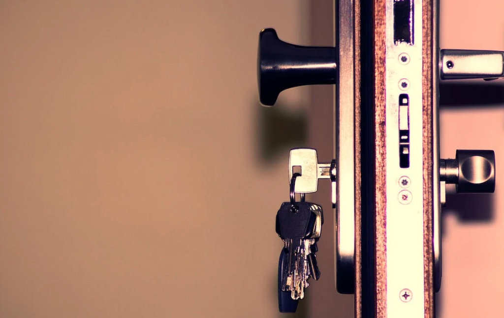 A close-up photograph of keys in a door lock
