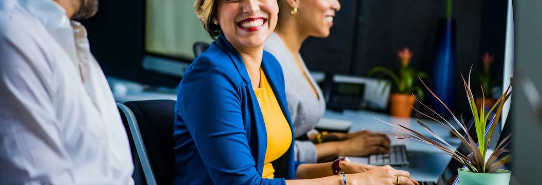Employees smiling in their workplace