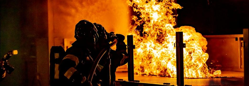 An image of firefighters taking out a fire