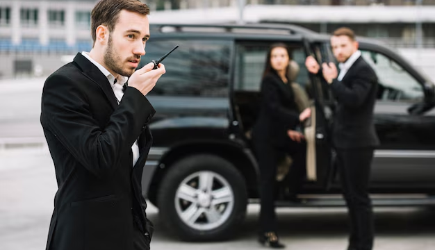 A security man working and communicating through an intercom for effective patrol coordination.