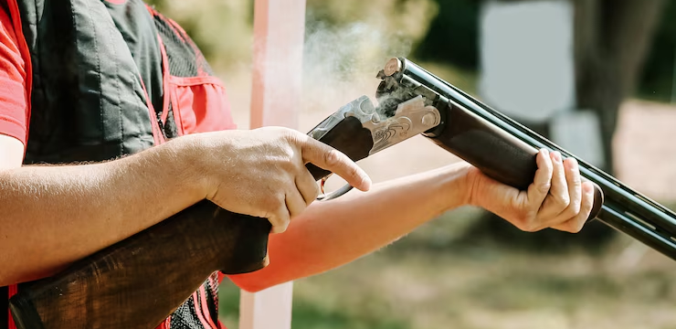 Active shooter with a gun in hand in a school environment.