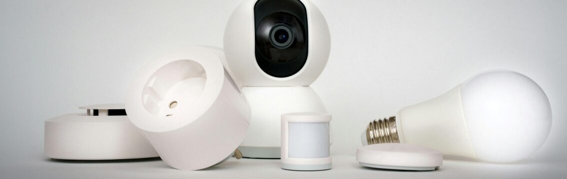 Minimalist setup showing smart security devices used for camera monitoring services in office environments